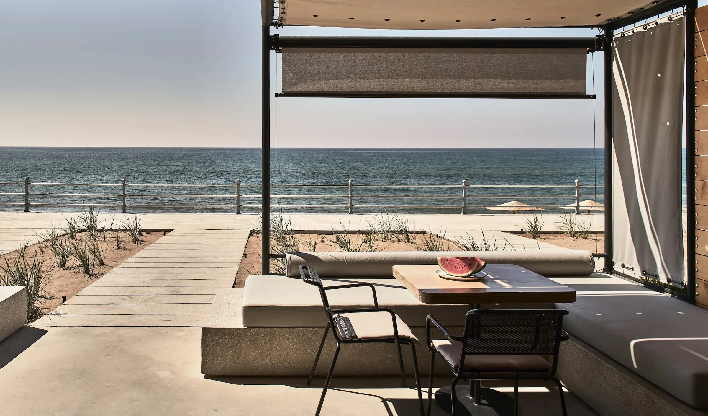 A beachfront suite terrace at Dexamenes Seaside Hotel