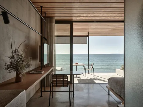 Glass-fronted Terrace Suite opening towards the Ionian Sea at Dexamenes