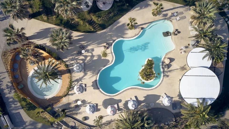 Aerial view of the free-form outdoor pool at Ekies All Senses Resort
