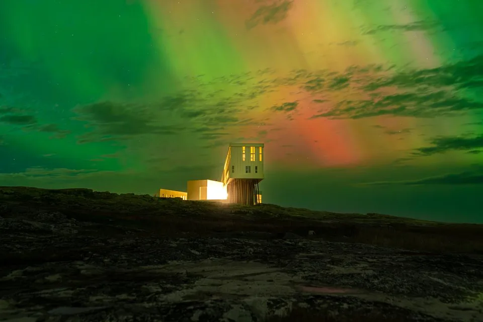 Fogo Island Inn beneath the northern lights on the Newfoundland coast