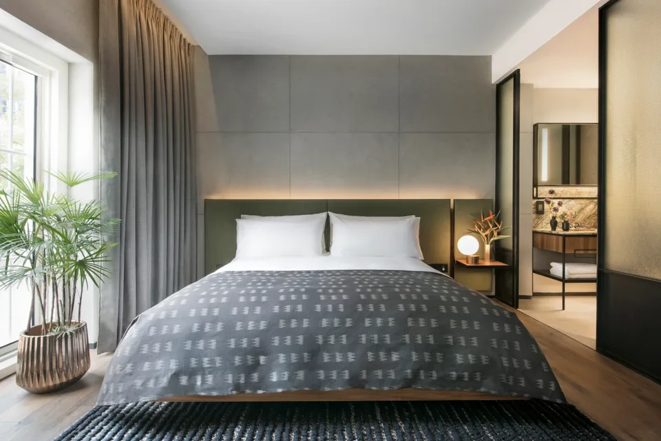 Contemporary guest bedroom with a king-sized bed at The Warehouse Hotel, Singapore
