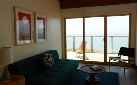 Living area of an ocean-facing suite at Timber Cove Resort