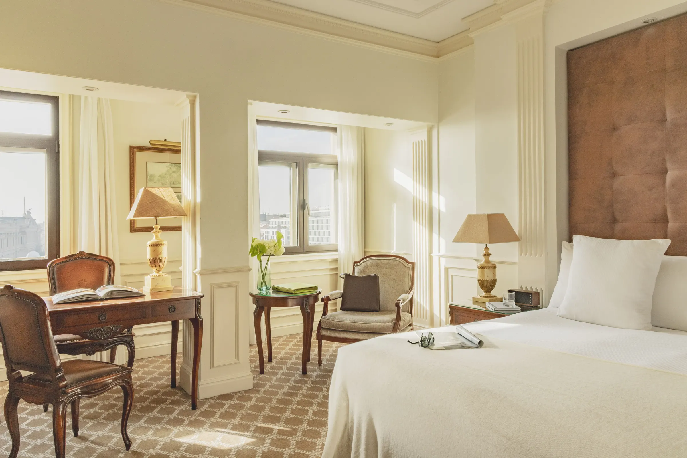 Light-filled bedroom with classic furniture at Hotel Fénix Gran Meliá