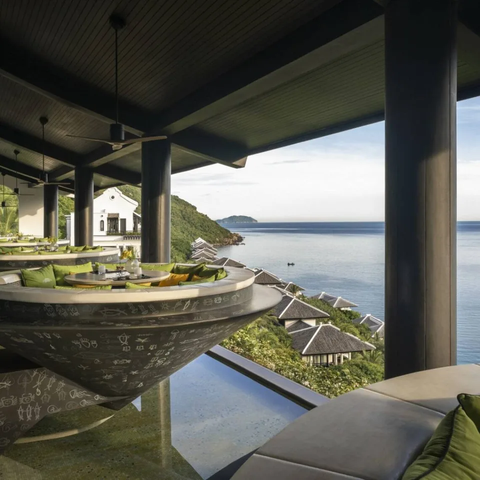 Conical outdoor dining booths at Citron overlooking the coast at InterContinental Danang