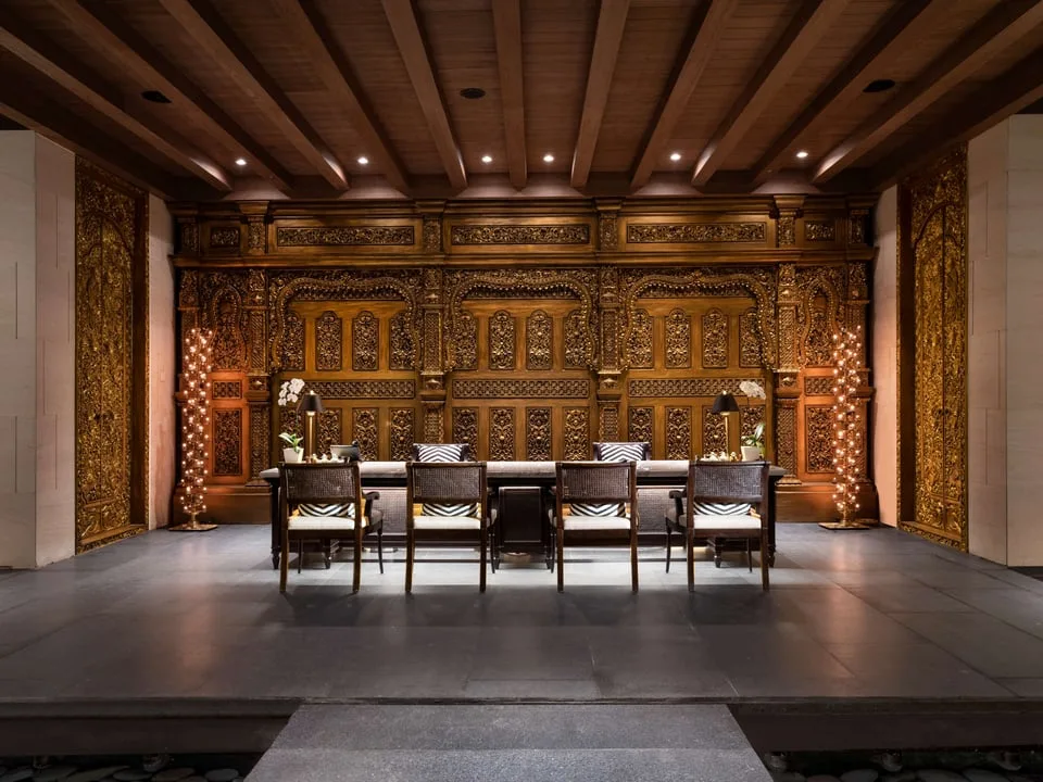 Carved wood interior and seating at The Apurva Kempinski Bali spa