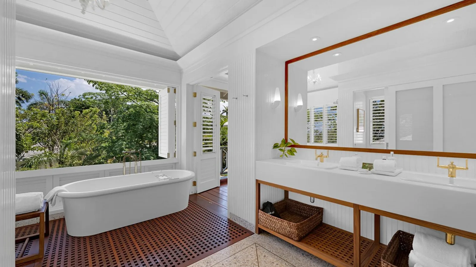 Bright bathroom with freestanding bath at Round Hill Hotel and Villas