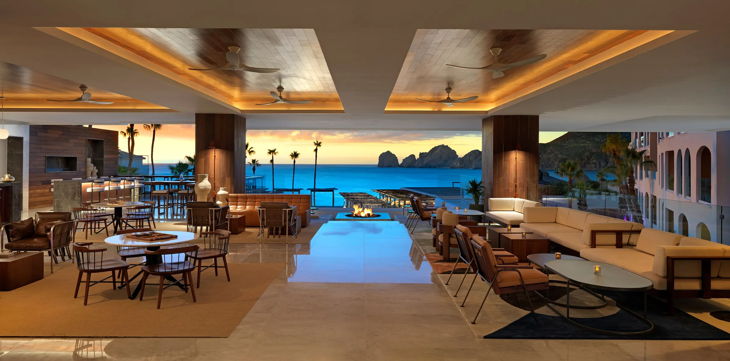 Open-air lounge facing the bay and El Arco at ME Cabo