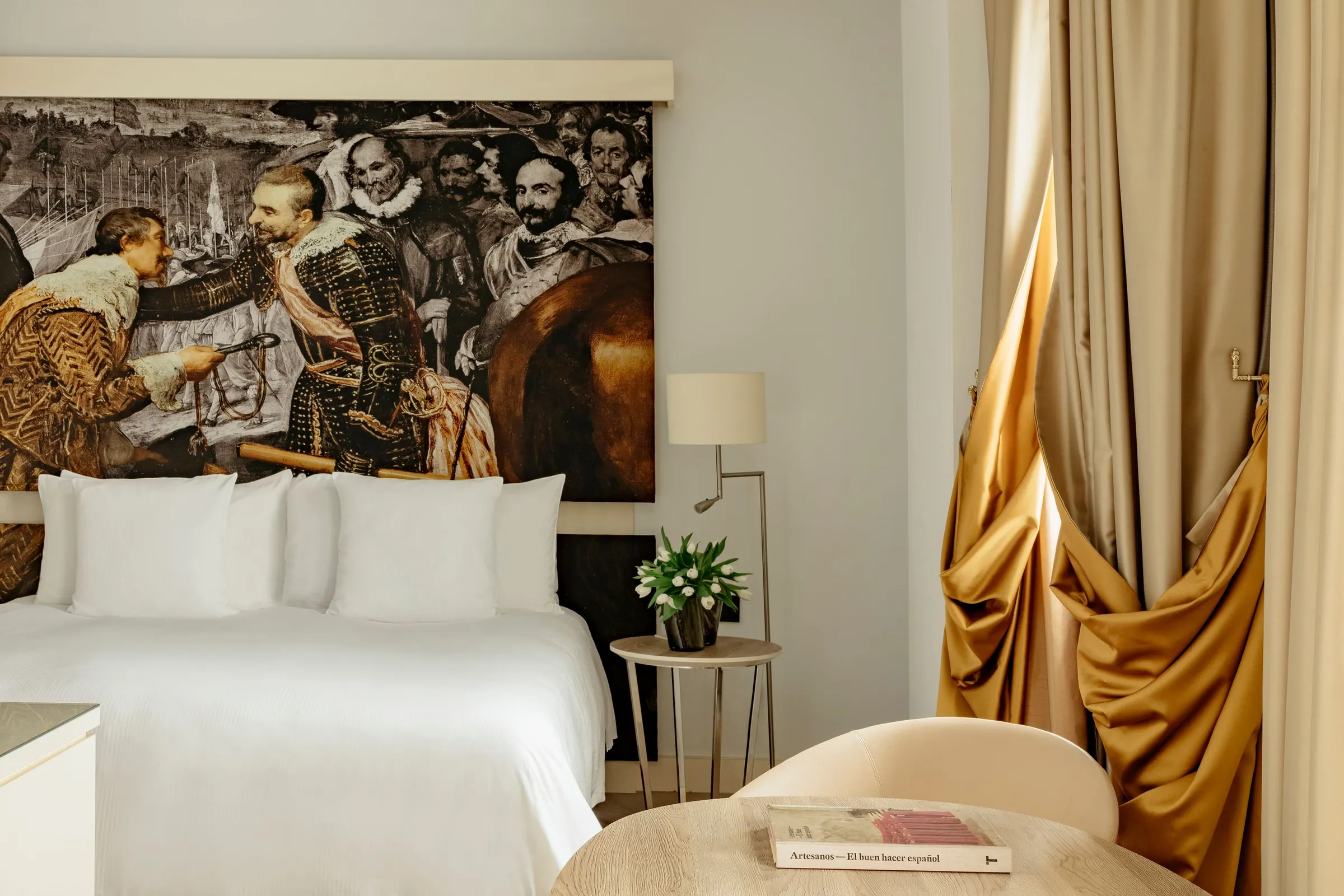 Guest room with a classical art mural at Palacio de los Duques Gran Meliá