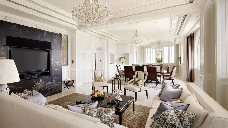 Chandeliers and cream seating in the Marco Polo Suite living room at The Peninsula Hong Kong